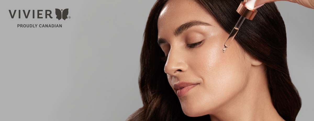 Clear glass dropper dispensing a golden drop of Vivier C E Peptides serum onto a white surface.